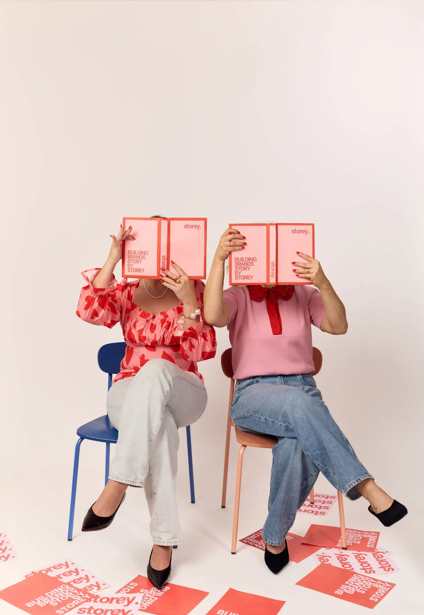 Storey founders holding Storey books